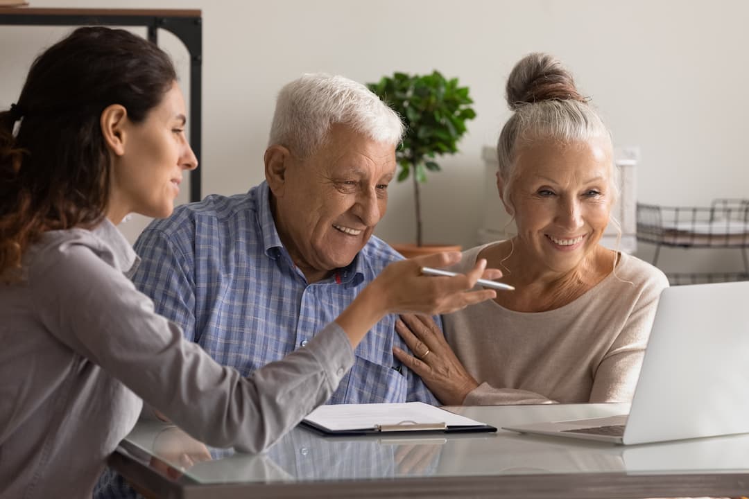 People looking at computer by an estate planner. Symbolic of our services - Wills and Estates Lawyer North Brisbane.